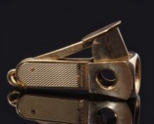 Late 20th century hallmarked 9ct gold encased cigar cutter with engine turned grips and ringlet