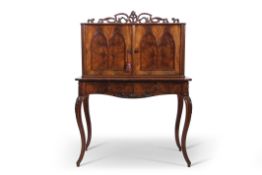 Early 19th century mahogany bonheur du jour, the scrolled pierced pediment over two arched panel