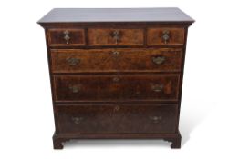 Early 18th century and later walnut chest, plain top over three drawers with three further full