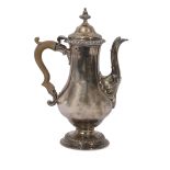 Late George II coffee pot of typical baluster form having gadrooned urn finial and rim to the hinged