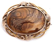 Antique landscape honey agate brooch in an ornate gold frame, 4 x 3cm