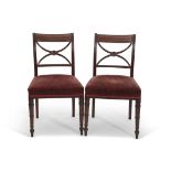 Set of 8 Regency period mahogany bar back dining chairs with X-frame splats over pink upholstered