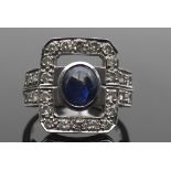 Sapphire and diamond dress ring, the carved open work rectangular panel centring an oval sapphire