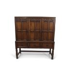 Early 20th century Waring & Gillow oak side cabinet in the Arts & Crafts manner, the front with