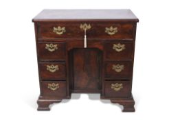 Mahogany small desk, full width frieze drawer over kneehole with cupboard and two integral