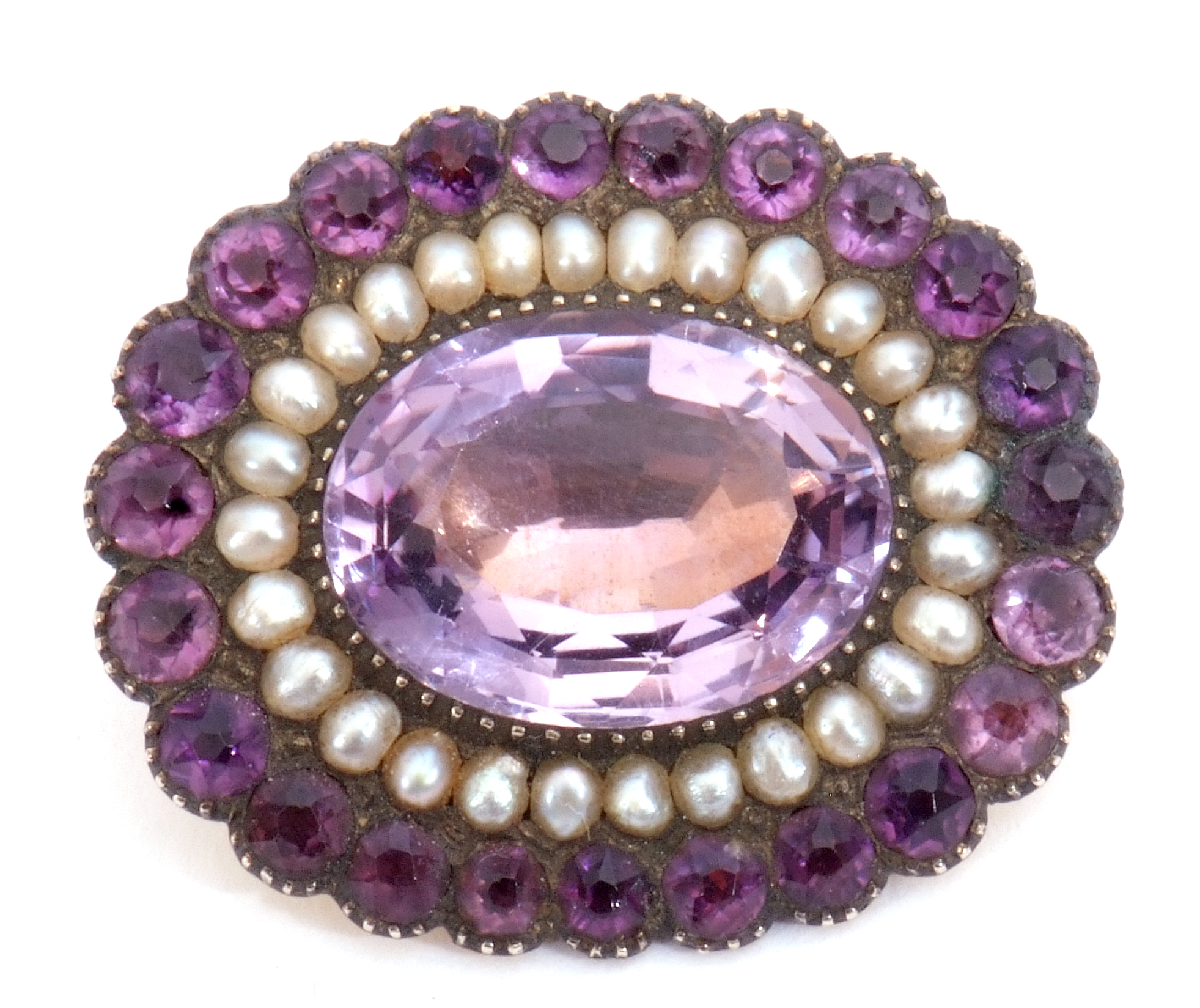 Victorian amethyst and seed pearl brooch, the large oval faceted amethyst 17mm x 12mm, within a seed - Image 2 of 5