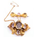 Victorian gold foil and ribbon design brooch with drop in rococo taste, set with semi-precious gem