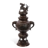 A late 19c Oriental Bronze censor the baluster body decorated applied with flying cranes