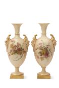 Pair of early 20th century Royal Worcester vases decorated with flowers with satyr mask handles on