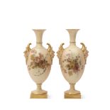 Pair of early 20th century Royal Worcester vases decorated with flowers with satyr mask handles on