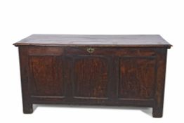 18th century oak coffer, plain plank top and three panel front, plain void interior on shortened