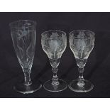 Pair of 18th century style wine glasses, finely engraved with fruiting vines above a double