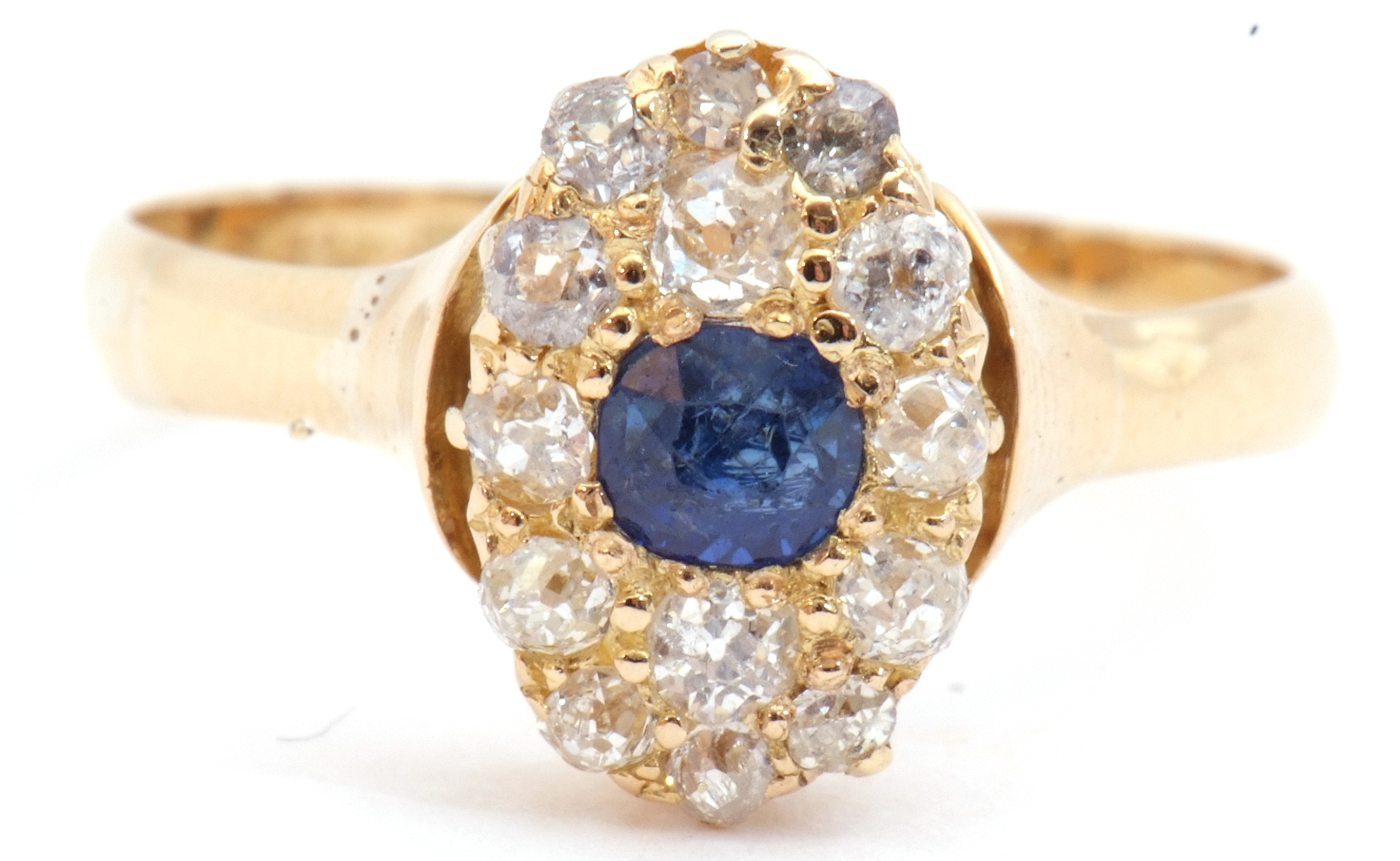 Sapphire and diamond cluster ring, the oval shaped design centring a round cut sapphire and 14 small - Image 2 of 8