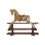 Vintage rocking horse (retailed by Hamleys) on a stained pine support (for restoration), 125cm high