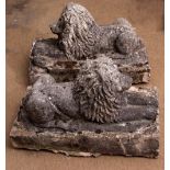 Pair of weathered composition models of reclining lions standing on integral bases (some losses