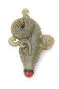 Chinese jade flask modelled with a boy on a carp with red button stopper, 11cm long