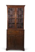 Mahogany secretaire bookcase, glazed top enclosing fitted shelving over a full width secretaire