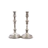 Pair of early 18th century style multi-knopped candlesticks, with loaded circular bases, base diam