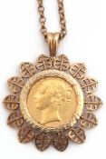 Victorian gold shield back sovereign within a hallmarked 9ct gold filigree leaf edge design pendant,