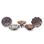 Dugan carnival glass blue plate in the apple blossom and twigs pattern, a Northwood amethyst three-
