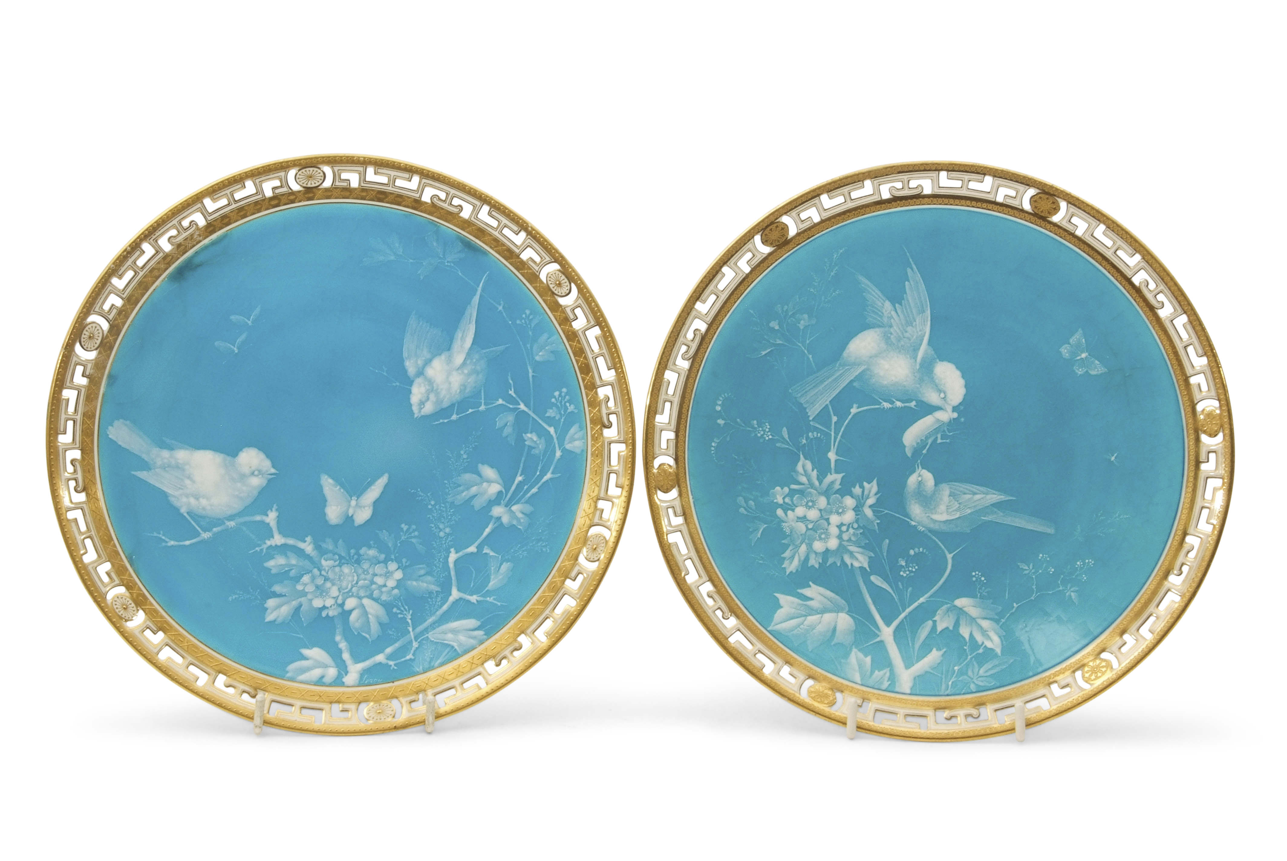 Pair of 19th century Minton plates with enamel decoration of birds on a turquoise ground within