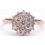 Diamond cluster ring set with 19 small diamonds in a three tier cluster design, diamond weight