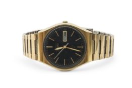 Last quarter of 20th century Gents gold plated Seiko evening watch with quartz day and date