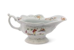 Small Worcester porcelain high footed sauce boat, circa 1755, the sides decorated in polychrome with