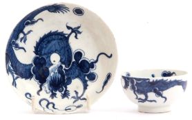 A Lowestoft porcelain teabowl and saucer, c1770, decorated with the dragon pattern, saucer 11cm