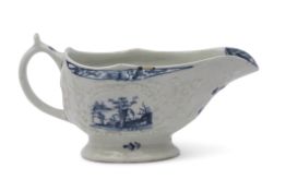 Small Lowestoft porcelain sauce boat with moulded decoration surrounding a cartouche with the little