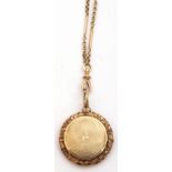 Unmarked Victorian gold circular vinaigrette, the engine turned lid opening to reveal a foliate