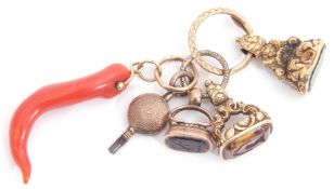 Group of three Victorian gold fobs, two with engraved detail, one plain, together with a watch