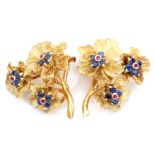 Pair of 18ct gold, sapphire and ruby earrings, a textured design featuring three graduated flower