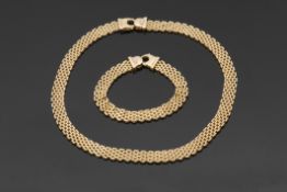 High grade yellow metal Oms flexible brickweave necklace with lobster claw catch, stamped ".750",