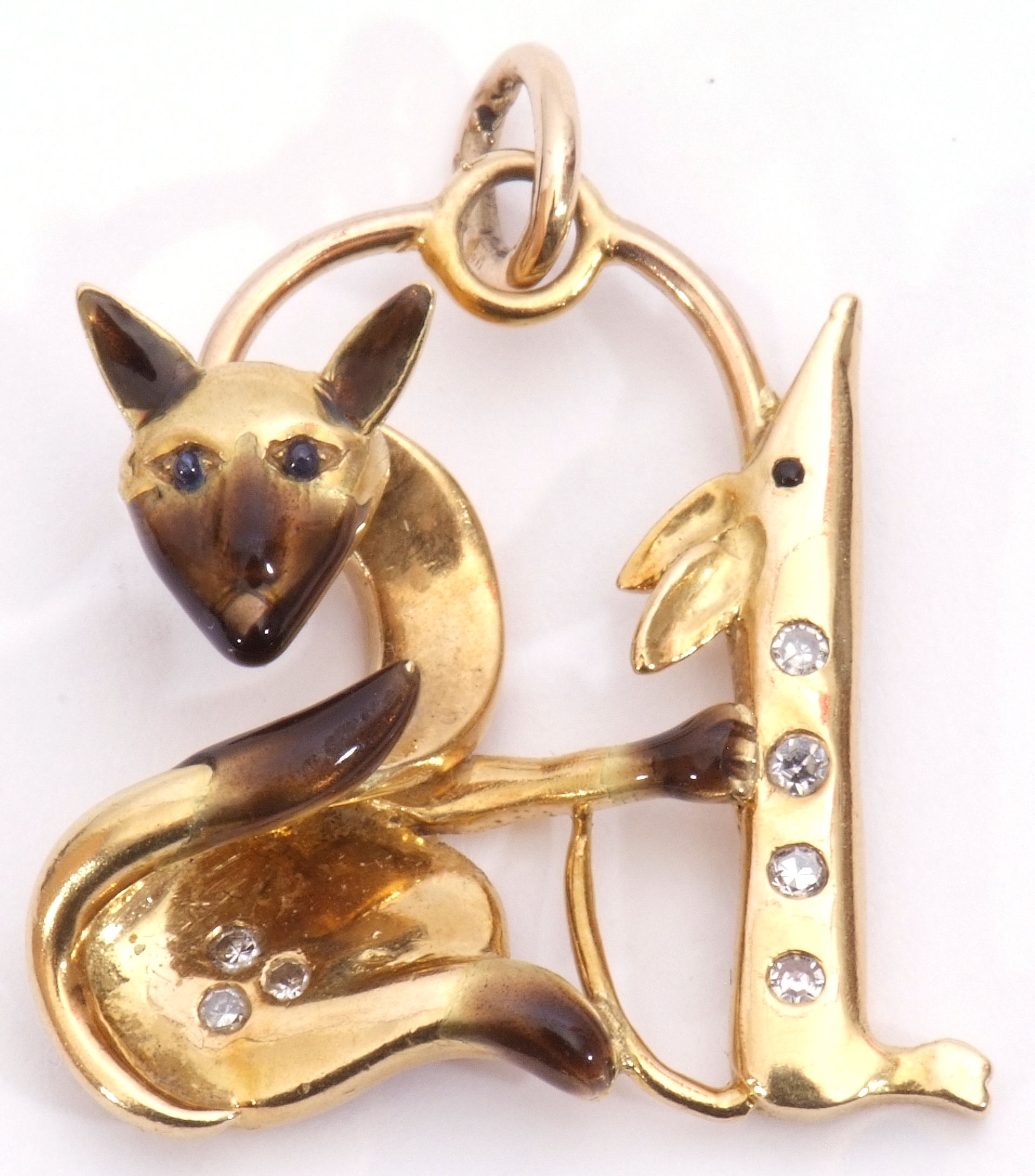 Yellow metal cat and mouse stylised pendant, each highlighted with small diamonds and sapphire set