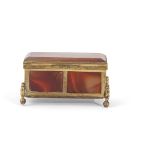 Mid/late 19th century gilt metal and carnelian agate chest formed box supported on four cast feet,