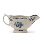 Lowestoft porcelain sauce boat decorated in blue and white with floral prints