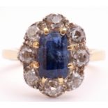 Sapphire and diamond cluster ring, the centre rectangular step cut sapphire 8 x 6mm, surrounded by 8