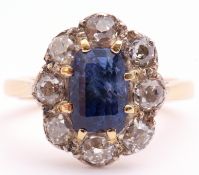 Sapphire and diamond cluster ring, the centre rectangular step cut sapphire 8 x 6mm, surrounded by 8