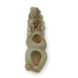 Chinese jade brush washer, the jade with some russet occlusions carved with a monkey at one end