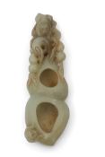 Chinese jade brush washer, the jade with some russet occlusions carved with a monkey at one end