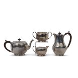Four piece tea set of circular baluster form comprising tea pot with composition handle and