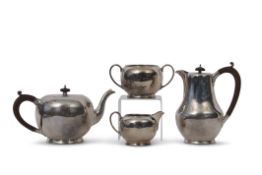 Four piece tea set of circular baluster form comprising tea pot with composition handle and