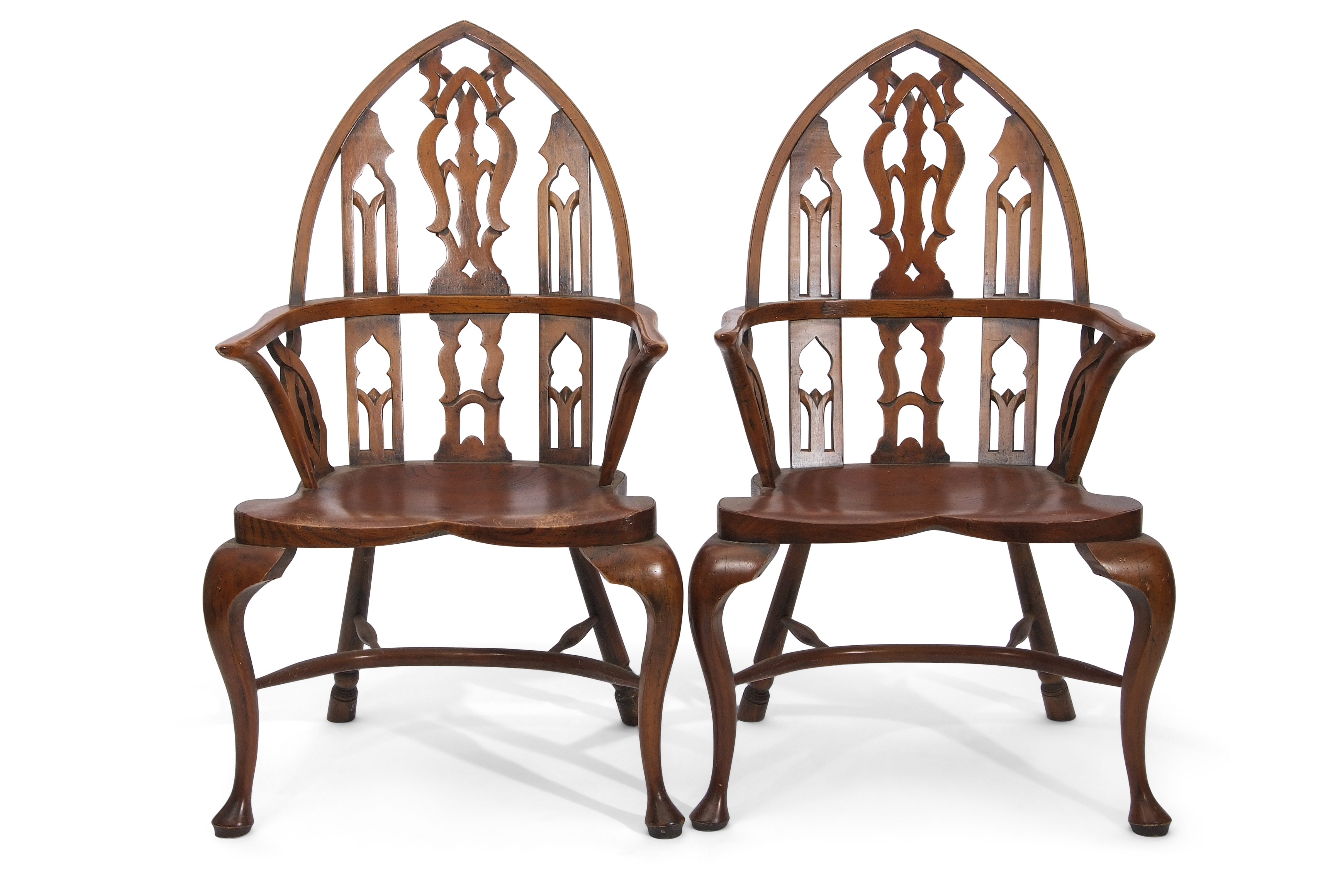 Set of five unusual Windsor chairs, the yew tops with lancet shaped backs and pierced central