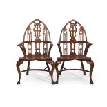 Set of five unusual Windsor chairs, the yew tops with lancet shaped backs and pierced central