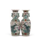 Pair of Chinese vases with polychrome decoration of dragons and birds with relief decoration of