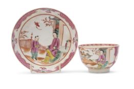 Lowestoft porcelain polychrome tea bowl and saucer with a chinoiserie design to centre within pink