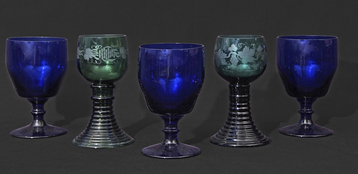 Two Bohemian style glasses with engraved decoration together with a further three Bristol Blue
