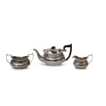George V three piece tea set of compressed oval form with raised body bands, gadrooned rims,