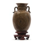 An unusual Chinese pottery vase with an agate or faux wooden effect glaze on wooden stand, 13cm